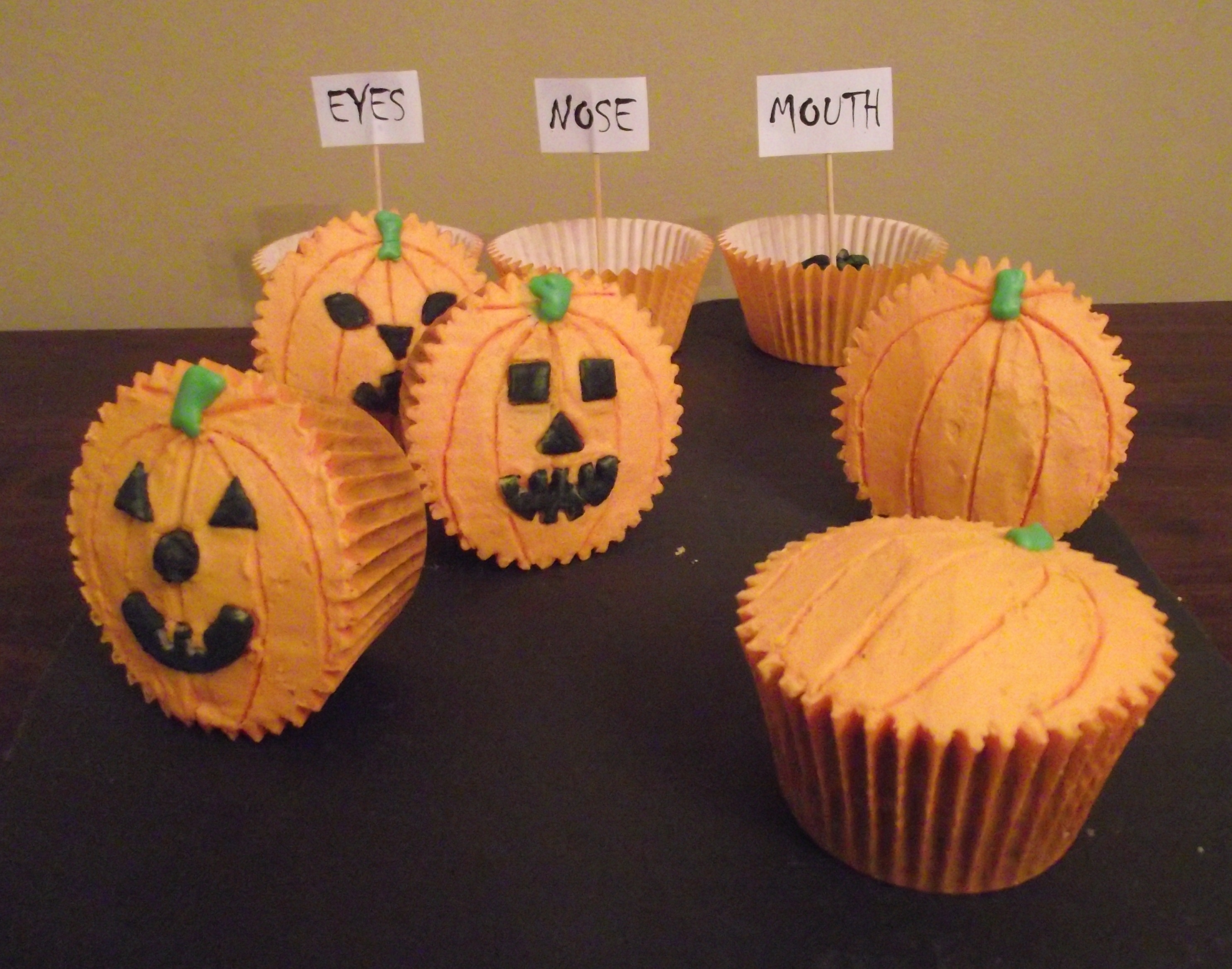 9 Pumpkin Face Cupcakes Photo Pumpkin Decorated Cupcakes Recipe