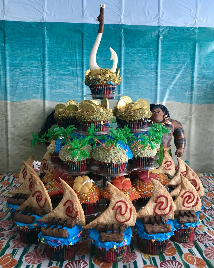 10 Moana Themed Birthday Cupcakes Photo Blue And Pink Flower Cupcakes Moana Birthday Party Cupcakes And Moana Party Food Ideas Snackncake 10 Moana Themed Birthday Cupcakes Photo Blue And Pink Flower Cupcakes Moana Birthday Party Cupcakes And Moana Party Food Ideas Snackncake