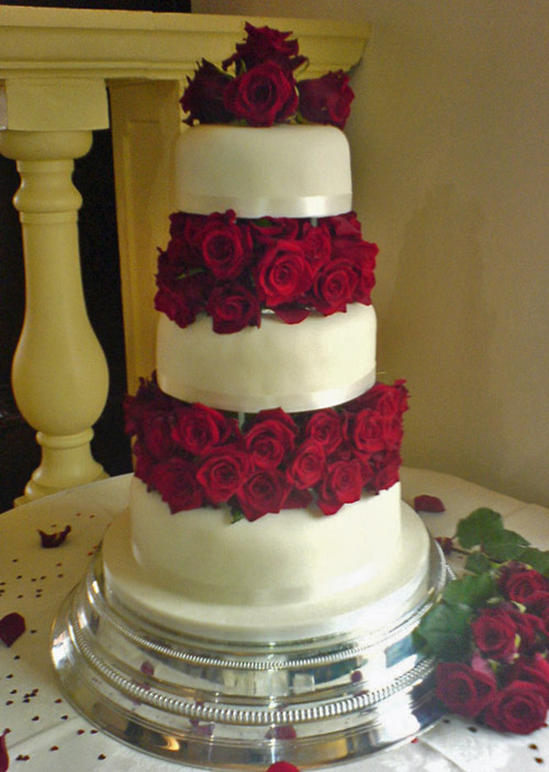 Tiered Wedding Cake with Fresh Roses Between Layers Tiered Wedding Cake with Fresh Roses Between Layers