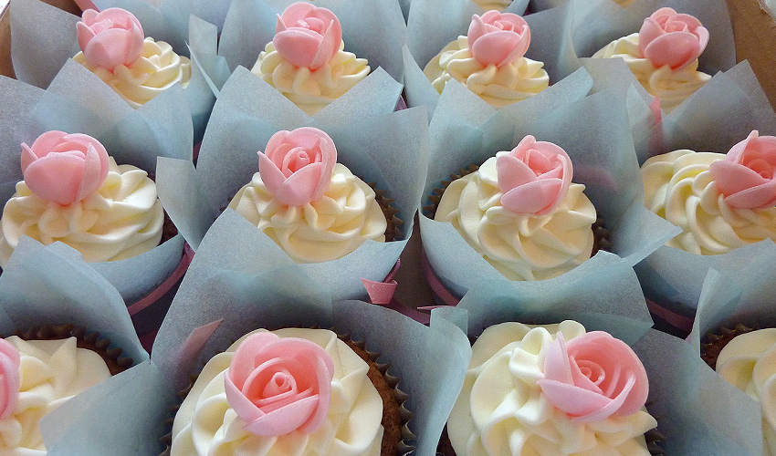 Vanilla Cupcake with Frosting and Pink Rose Vanilla Cupcake with Frosting and Pink Rose