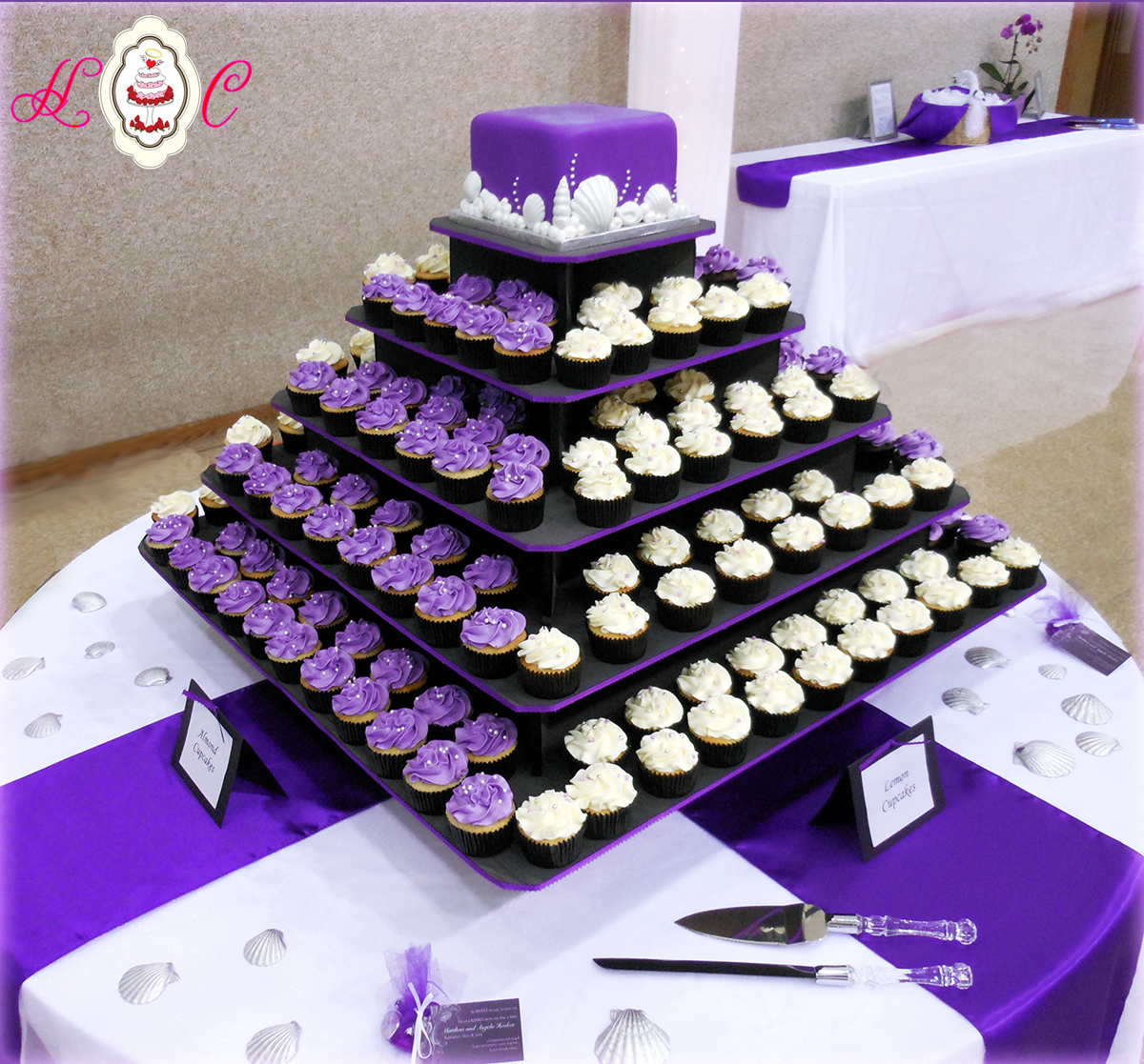 Purple and White Wedding Cake with Cupcakes