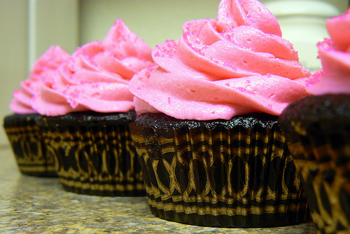 Pink Cupcakes with Chocolate Frosting and Sprinkles