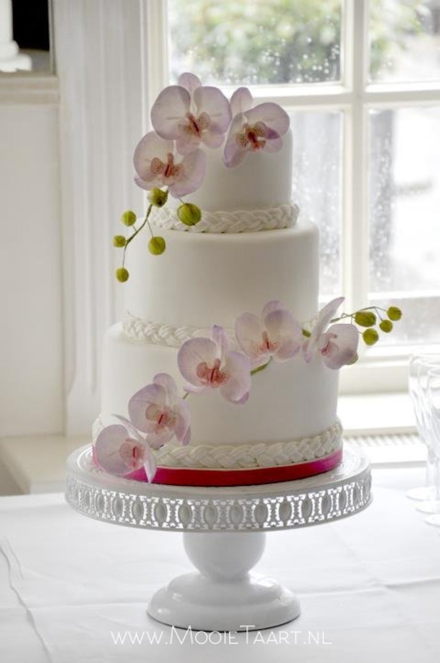 White Wedding Cake with Orchids