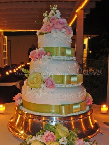 Wedding Cake with Ribbon and Pink Flowers