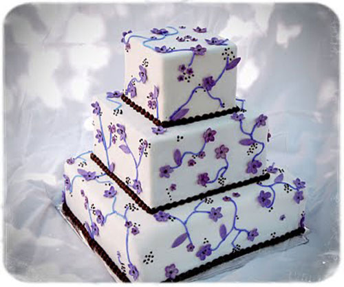 White Wedding Cake with Purple Flowers