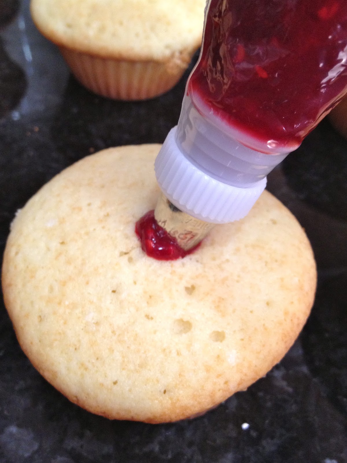 White Cupcakes with Raspberry Filling White Cupcakes with Raspberry Filling