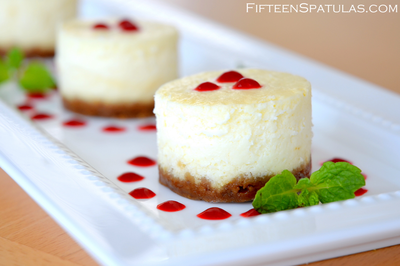 Mini Cheesecakes with Raspberry Sauce Mini Cheesecakes with Raspberry Sauce