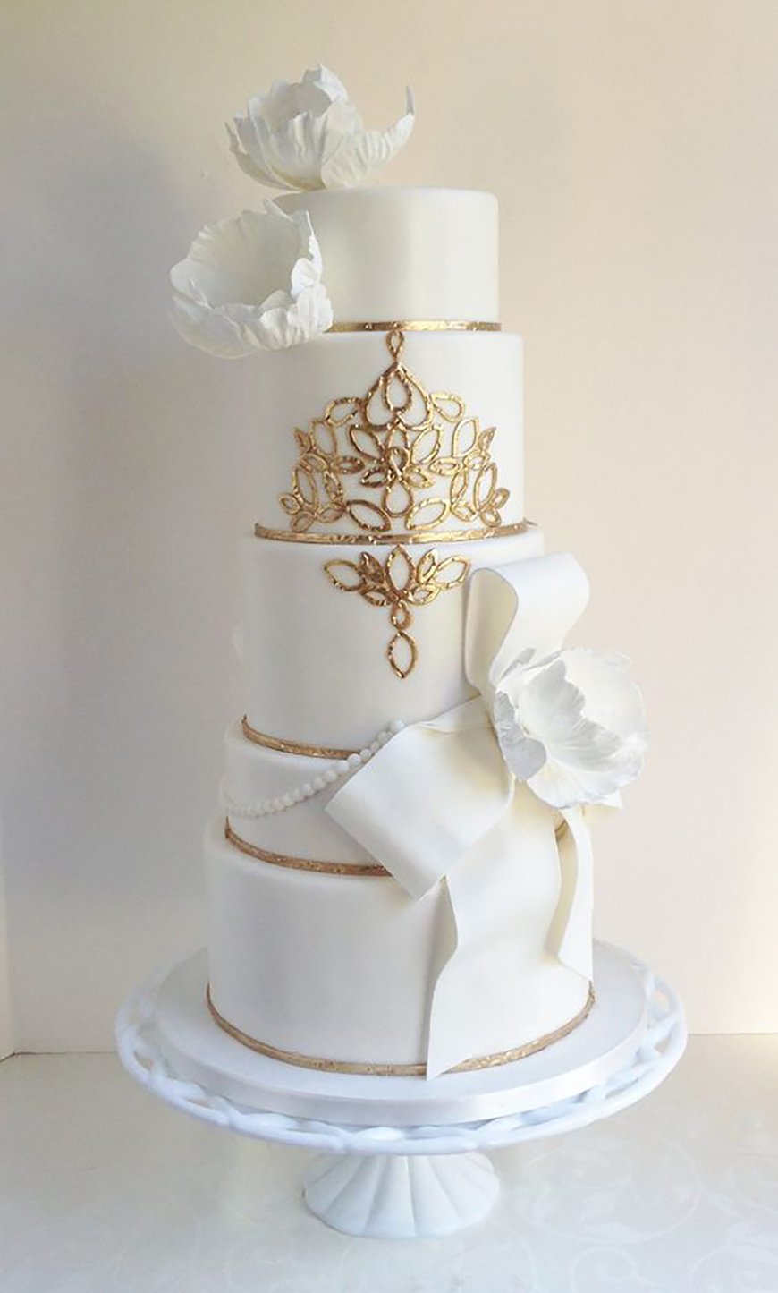 Elegant Gold and White Wedding Cake