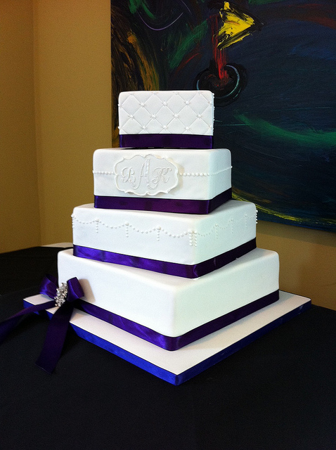 White Wedding Cake with Purple Ribbon