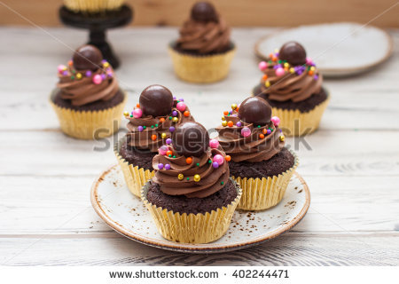 Cupcakes with Frosting and Chocolate Balls Gold Cupcakes with Frosting and Chocolate Balls Gold