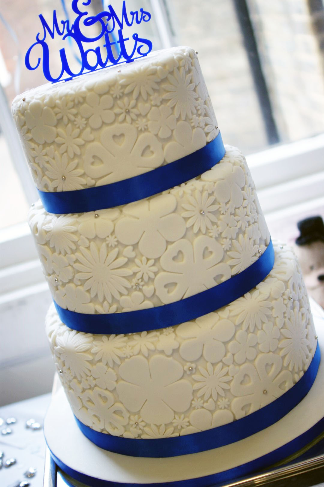 3 Tier Wedding Cakes with Royal Blue Flowers