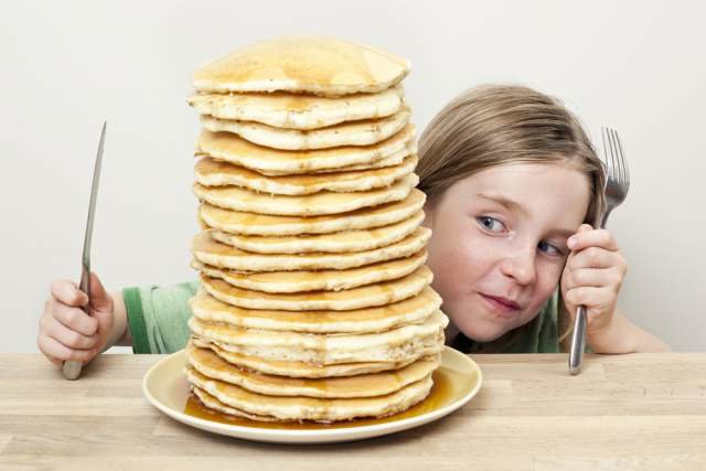 Eating a Large Stack of Pancakes Eating a Large Stack of Pancakes