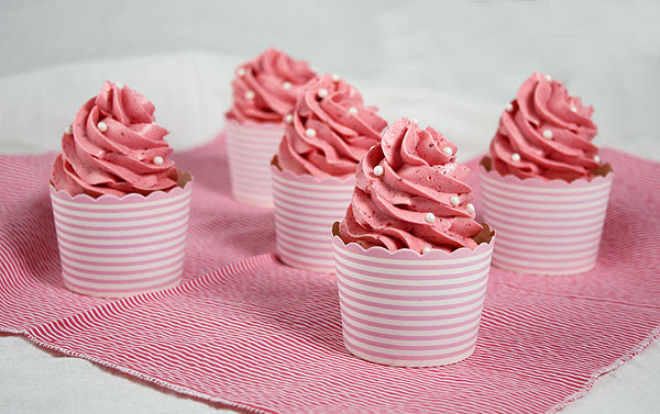 White Cupcakes with Strawberry Frosting