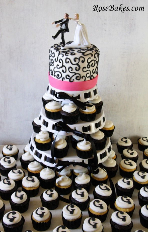 Pink Black and White Wedding Cake with Cupcakes