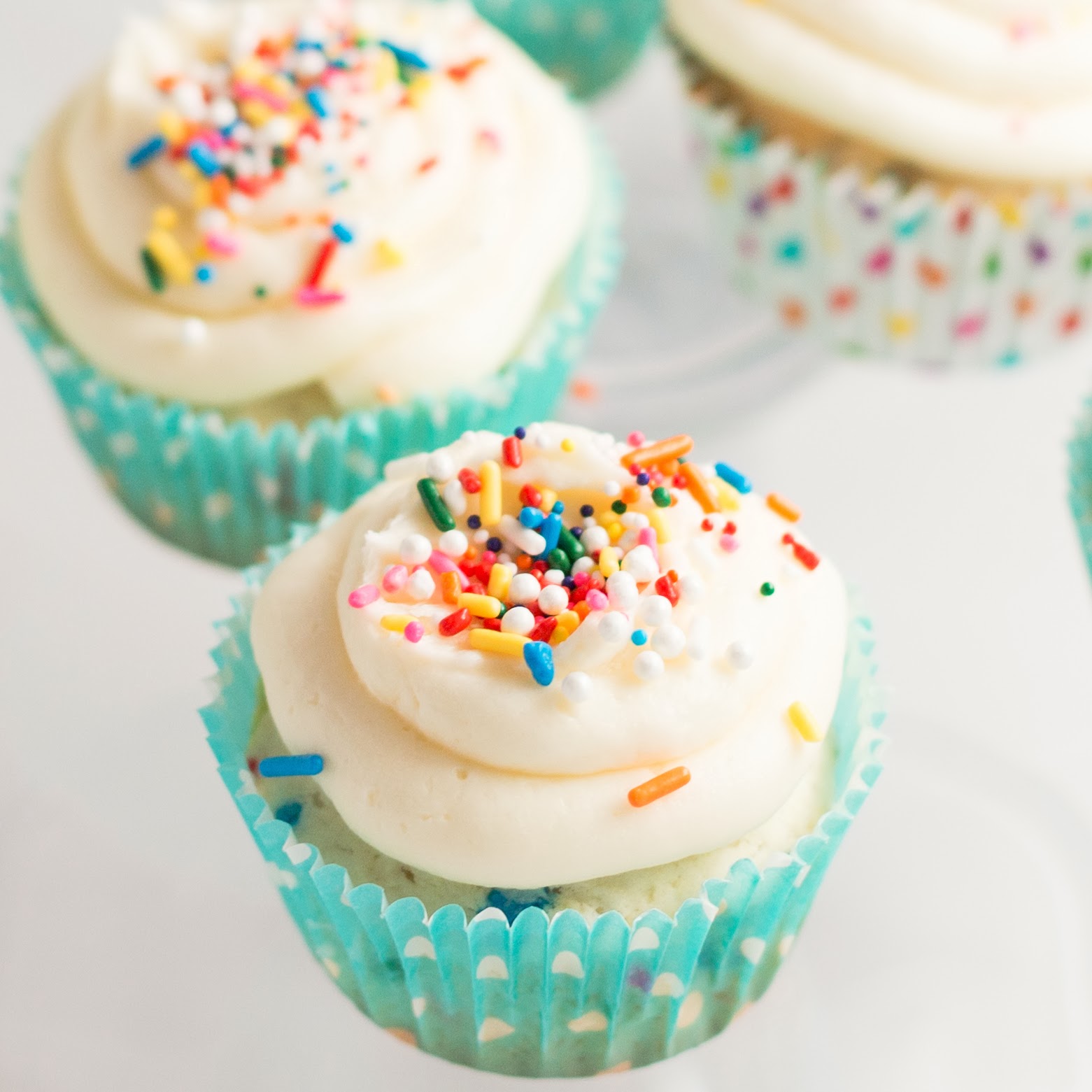 Vanilla Cupcakes with Frosting and Sprinkles