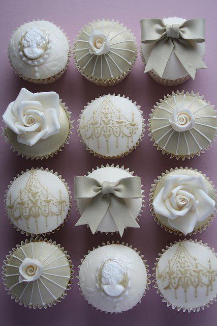 White and Gold Wedding Cake with Cupcakes