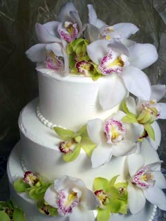 White Buttercream Wedding Cake with Orchids White Buttercream Wedding Cake with Orchids